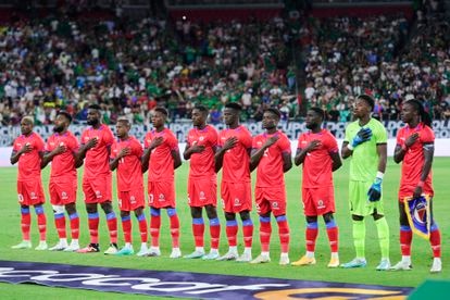   Haiti players sing the national anthem before a match between Haiti and Mexico as part of the 2023 CONCACAF Gold Cup at State Farm Stadium on June 29, 2023 in Glendale, Arizona. 