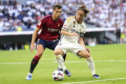 Luka Modric and Lucas Torro in a play during the match.